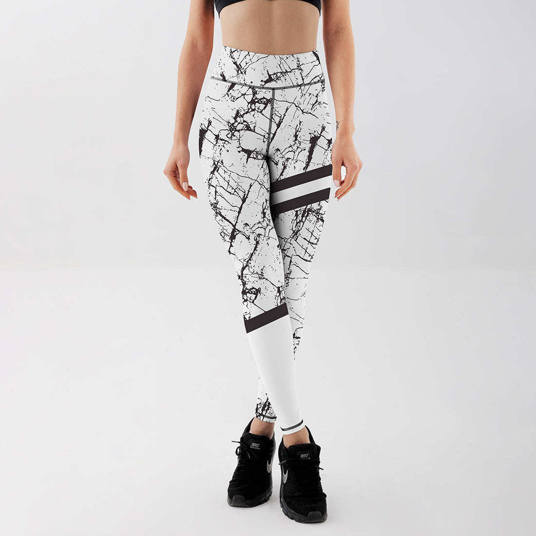 Kobiece Legginsy Wysoki Stan z Elastycznym Krojem i Marmurowym Wzorem Czarnym i Białym